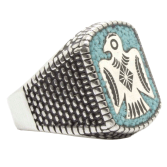 Silver ring with a Thunderbird emblem on turquoise stone