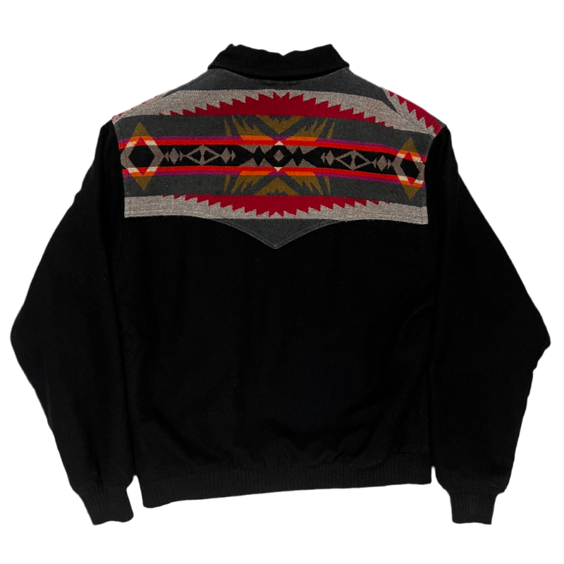 Black jacket with a patterned shoulder.