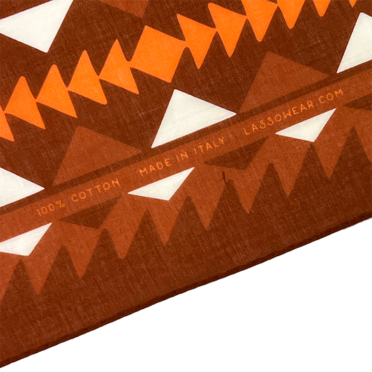 Close-up of a patterned fabric with geometric shapes and 'Lasso' branding.