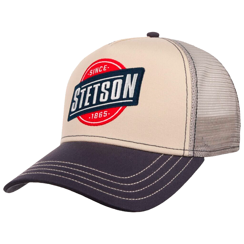 A Stetson brand trucker hat with a beige front panel, dark navy brim and embroidered logo, and a gray mesh back.