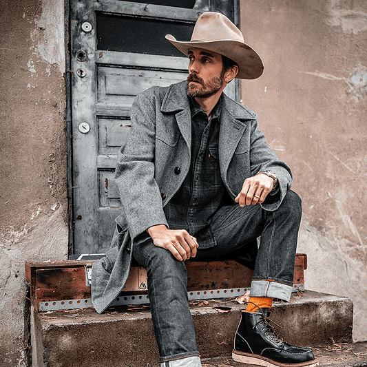 A man wearing a vintage Pendleton wool coat.