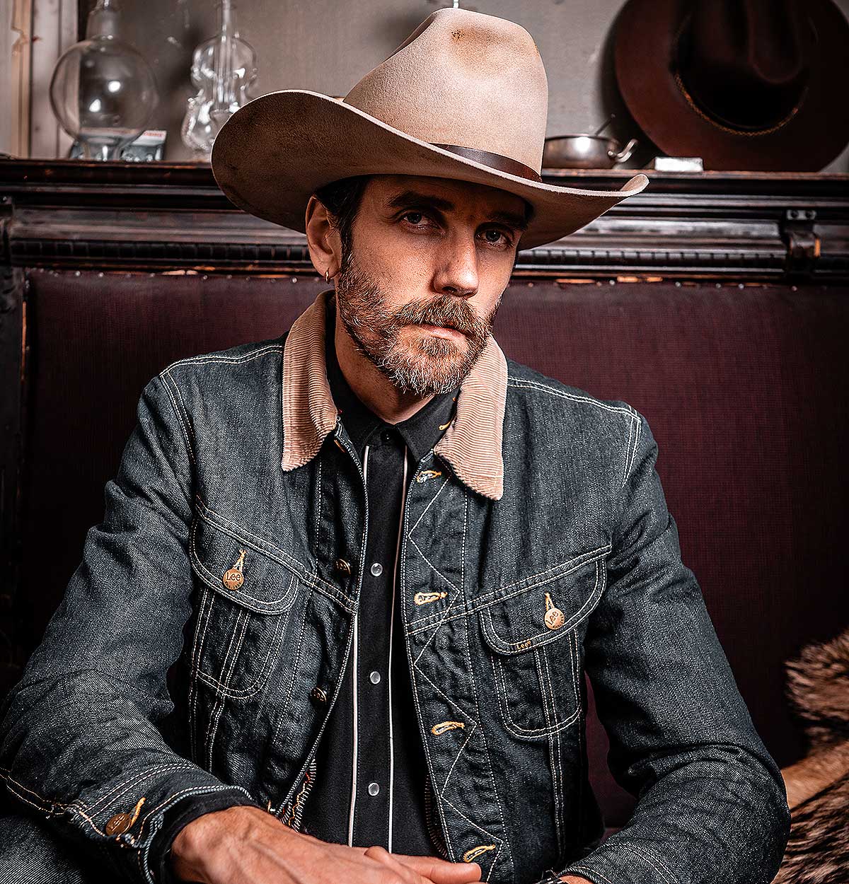 A man wearing a denim jacket