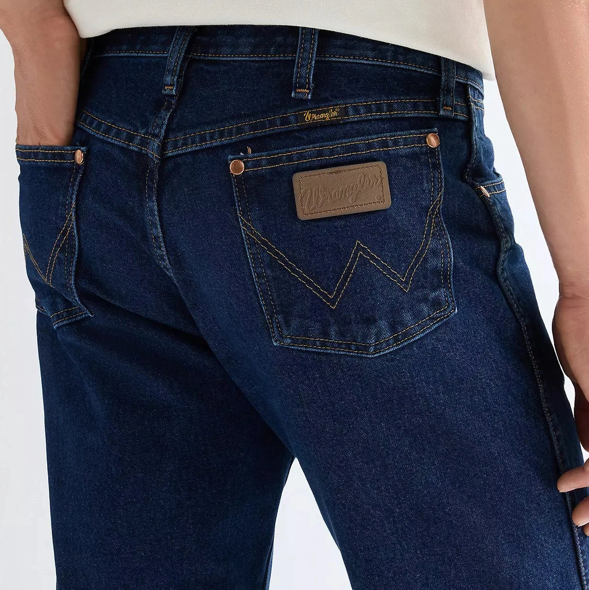 Blue Wrangler 13MWZ Cowboy Cut jeans with a Wrangler logo on the pocket against a white background