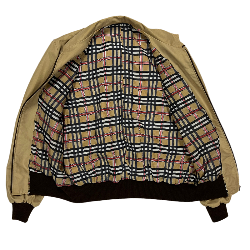Beige jacket with plaid pattern lining.