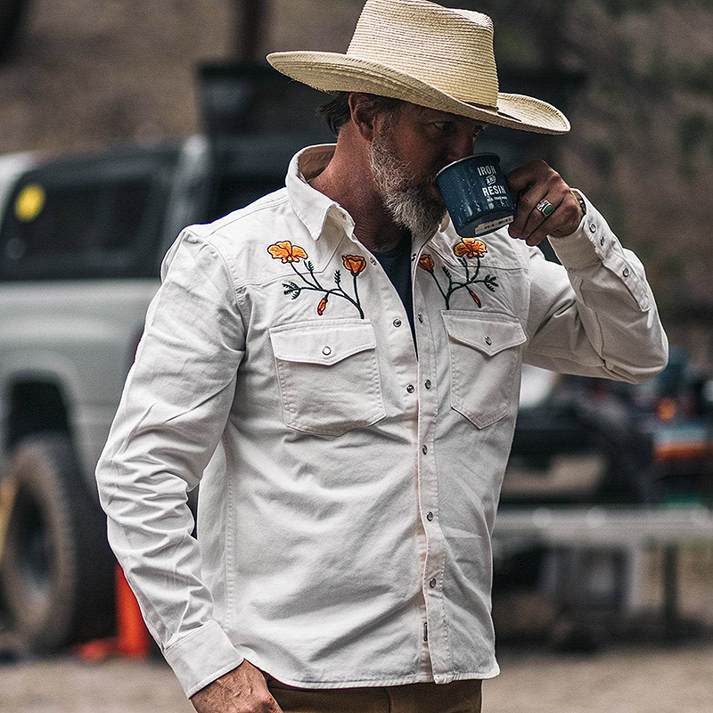 A man wearing a white western shirt