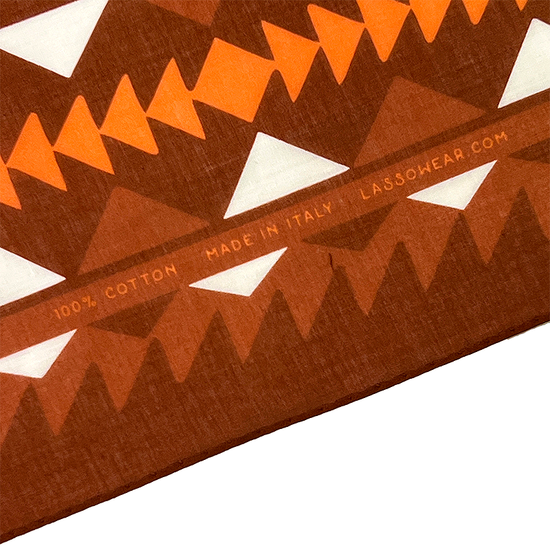 Close-up of a patterned fabric with geometric shapes and 'Lasso' branding.
