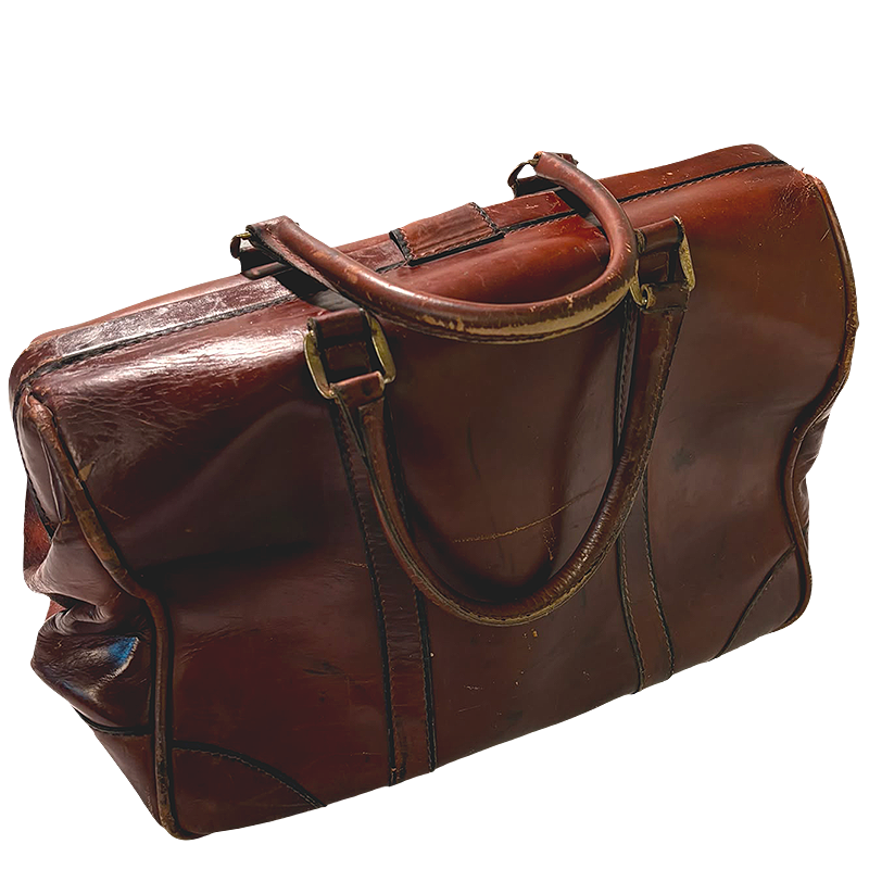 A vintage brown leather duffel bag with distressed edges and gold-tone hardware.