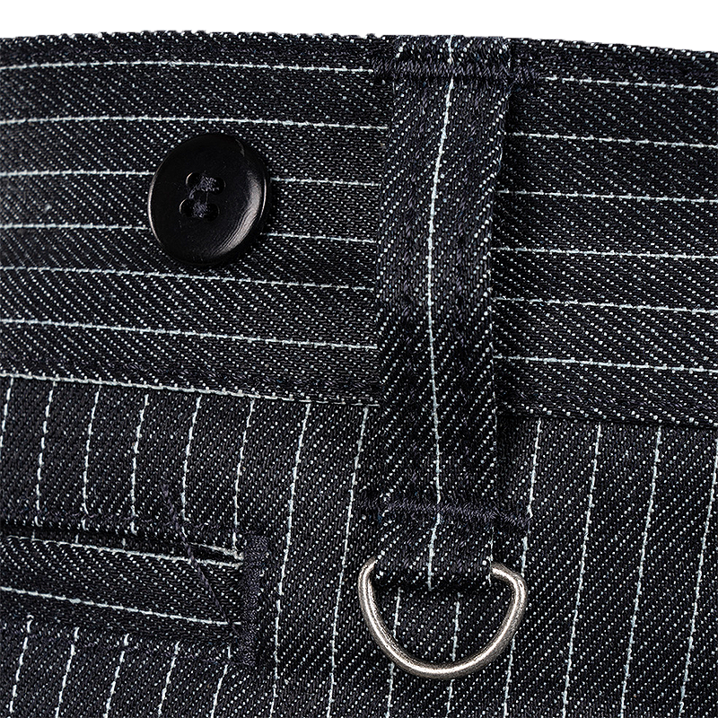 Close-up of blue indigo Wabash pinstriped denim fabric with a black button, and a silver metal D-ring.