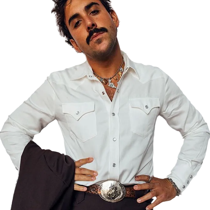 Man wearing a white western shirt with a large belt buckle and holding a jacket
