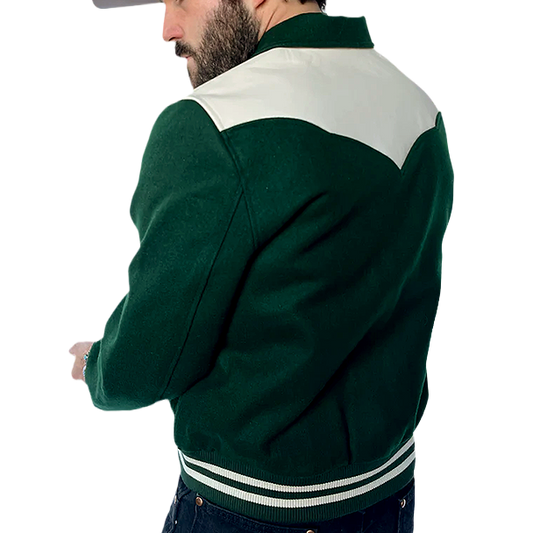 Man wearing a green and white western jacket, seen from the back.